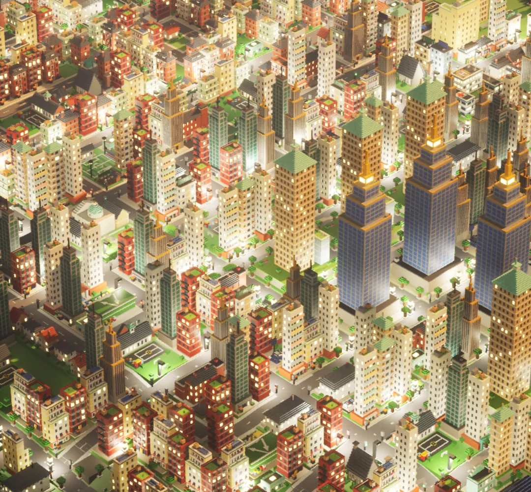 A town centre from above at golden hour: lit flats and blue-glass towers on a grid of busy streets.